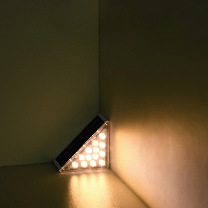 Triangular LED light fixture on a corner wall