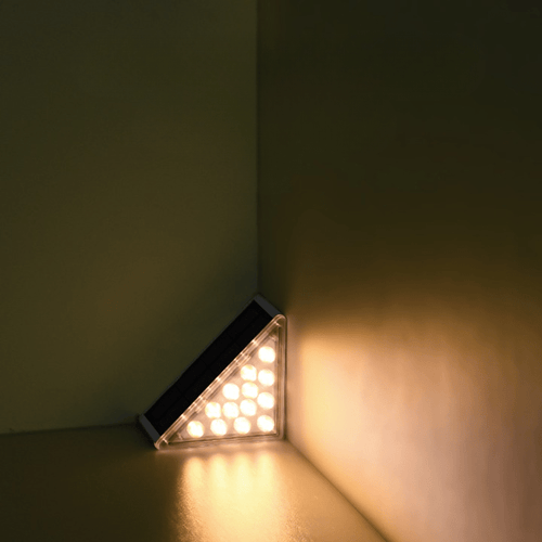 Triangular LED light fixture on a corner wall