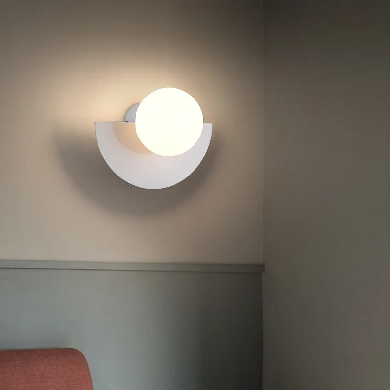 Wall-mounted light fixture on a neutral wall