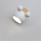 Modern wall light fixture with white and wooden design on a gray background