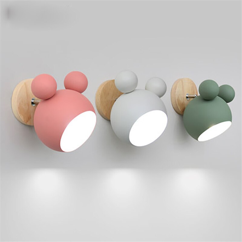 Three Kleurful wall lights with round, bubble-like design on a light gray background