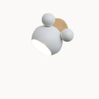 Modern wall light fixture with white and wooden design on a gray background