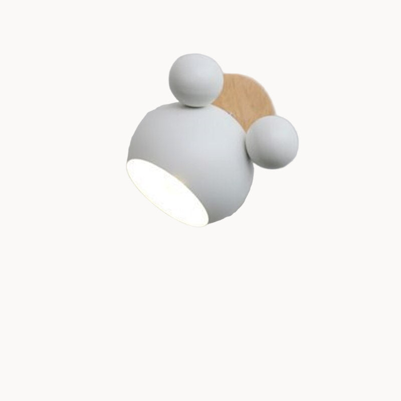 Modern wall light fixture with white and wooden design on a gray background