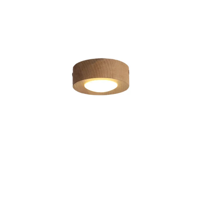 Round wooden light fixture on a white background